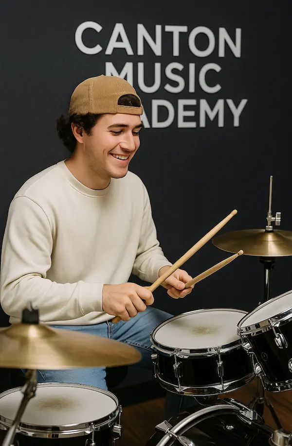 student playing drums during drum lesson at Canton Music Academy